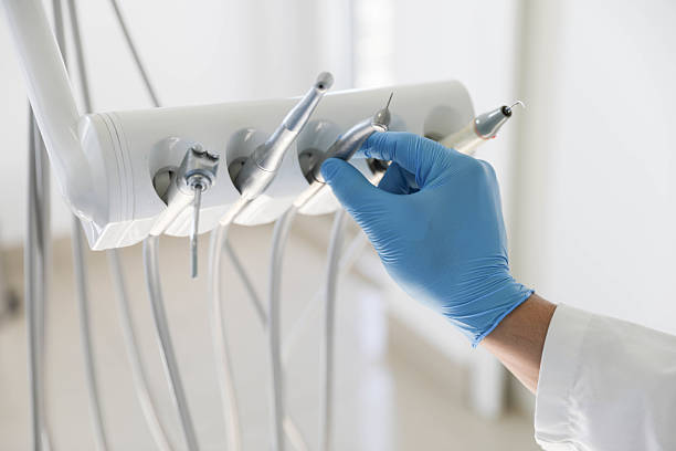 Professional Tooth Extraction technician working in De Witt County County, IL